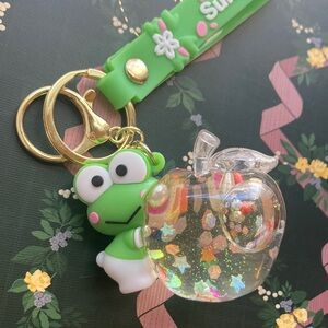 Keroppi holding glitter filled Apple Keychain